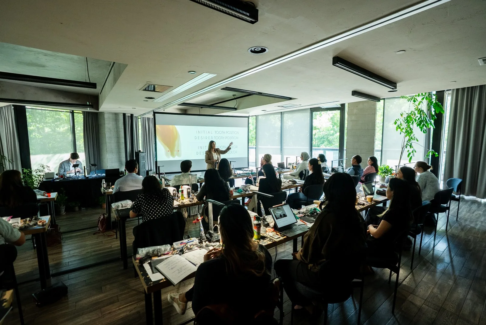 Dr. Andi-Jean Miro teaches initial versus desired tooth position and color to a room of dentists