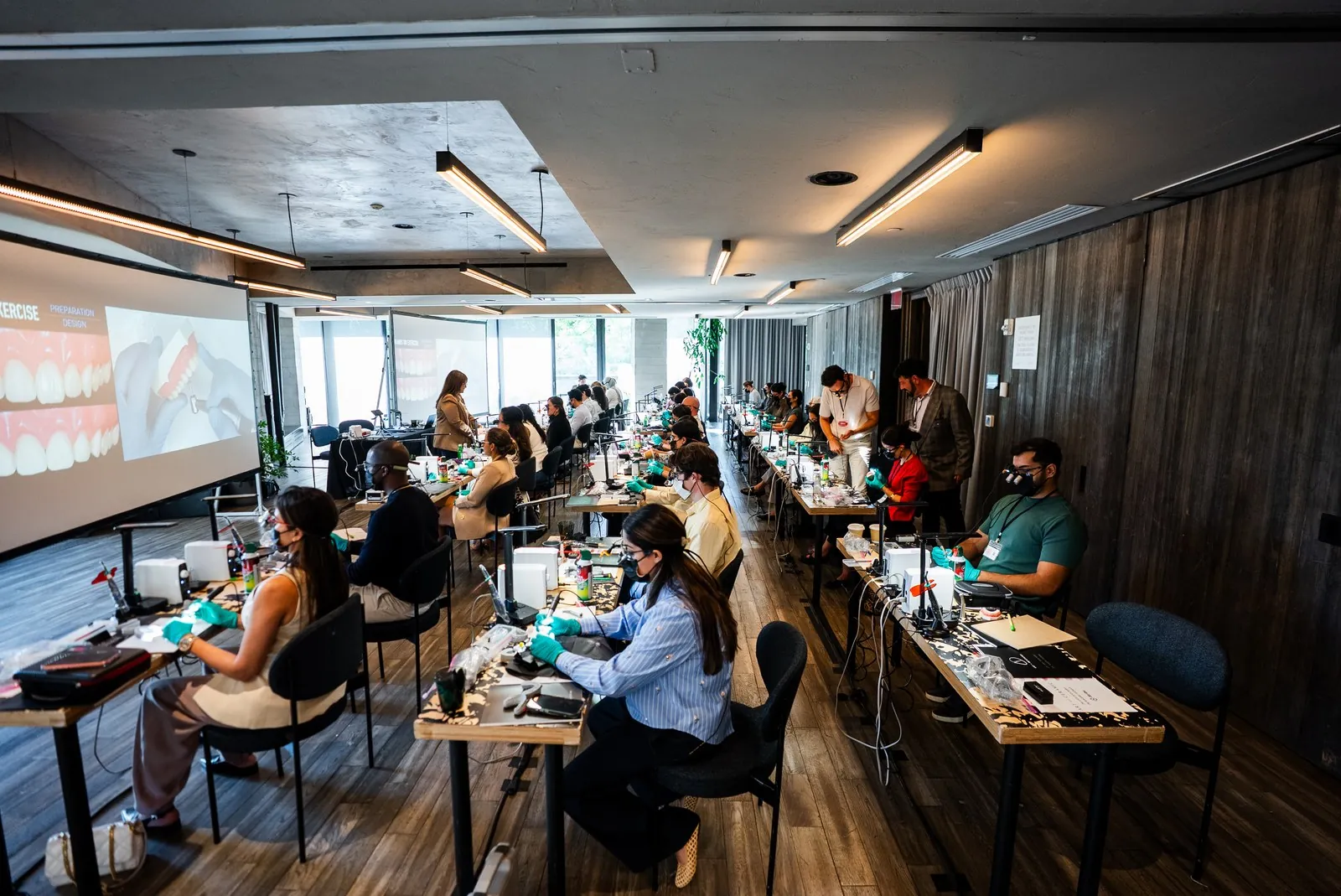 Dentists at their benches during an Art of Ceramic hands-on veneer course